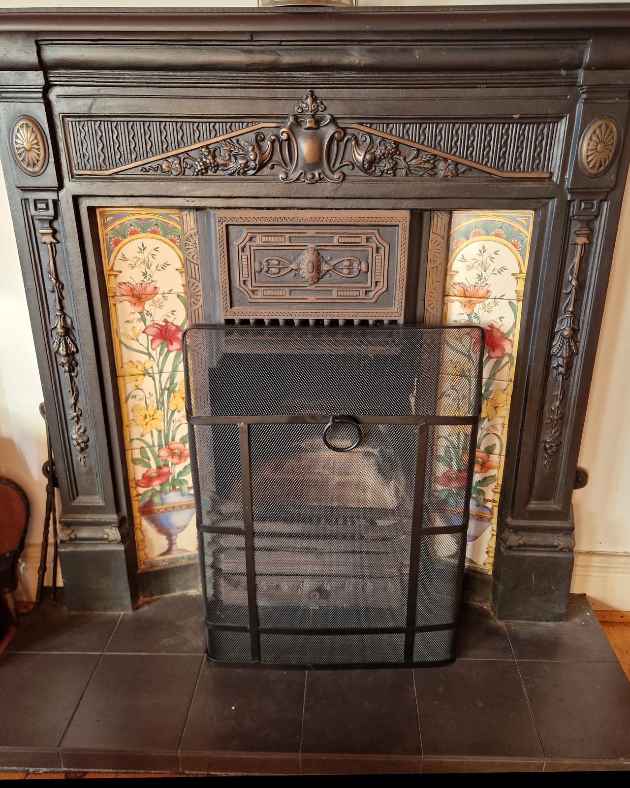 The cast iron fireplace in the living room